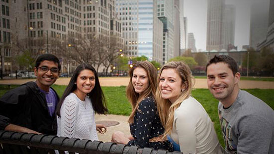 Students sitting on a bench on the Chicago campus
